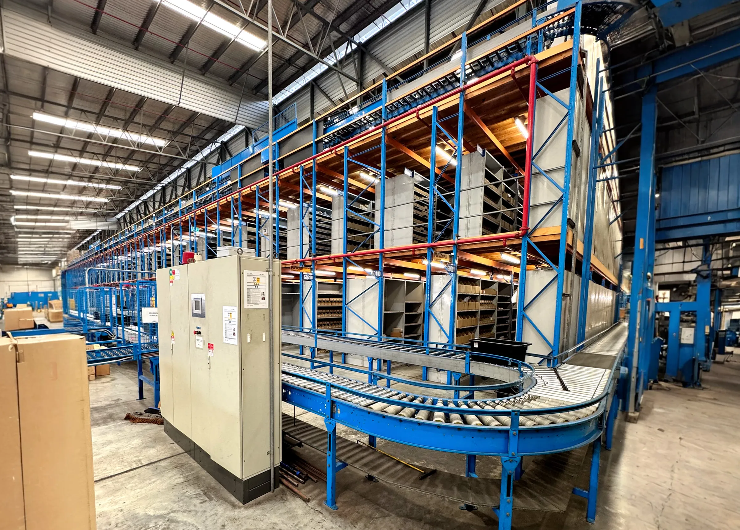 Hero image showing upgraded conveyor system inside the Dexion Amcap warehouse completed by CPR Electrical